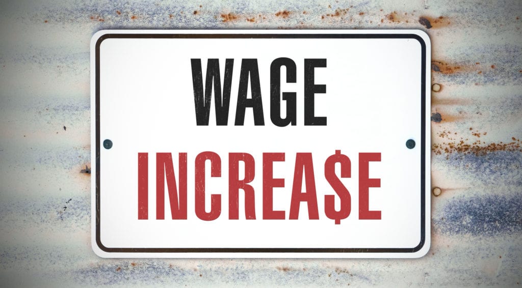 A sign that says "WAGE INCREASE."